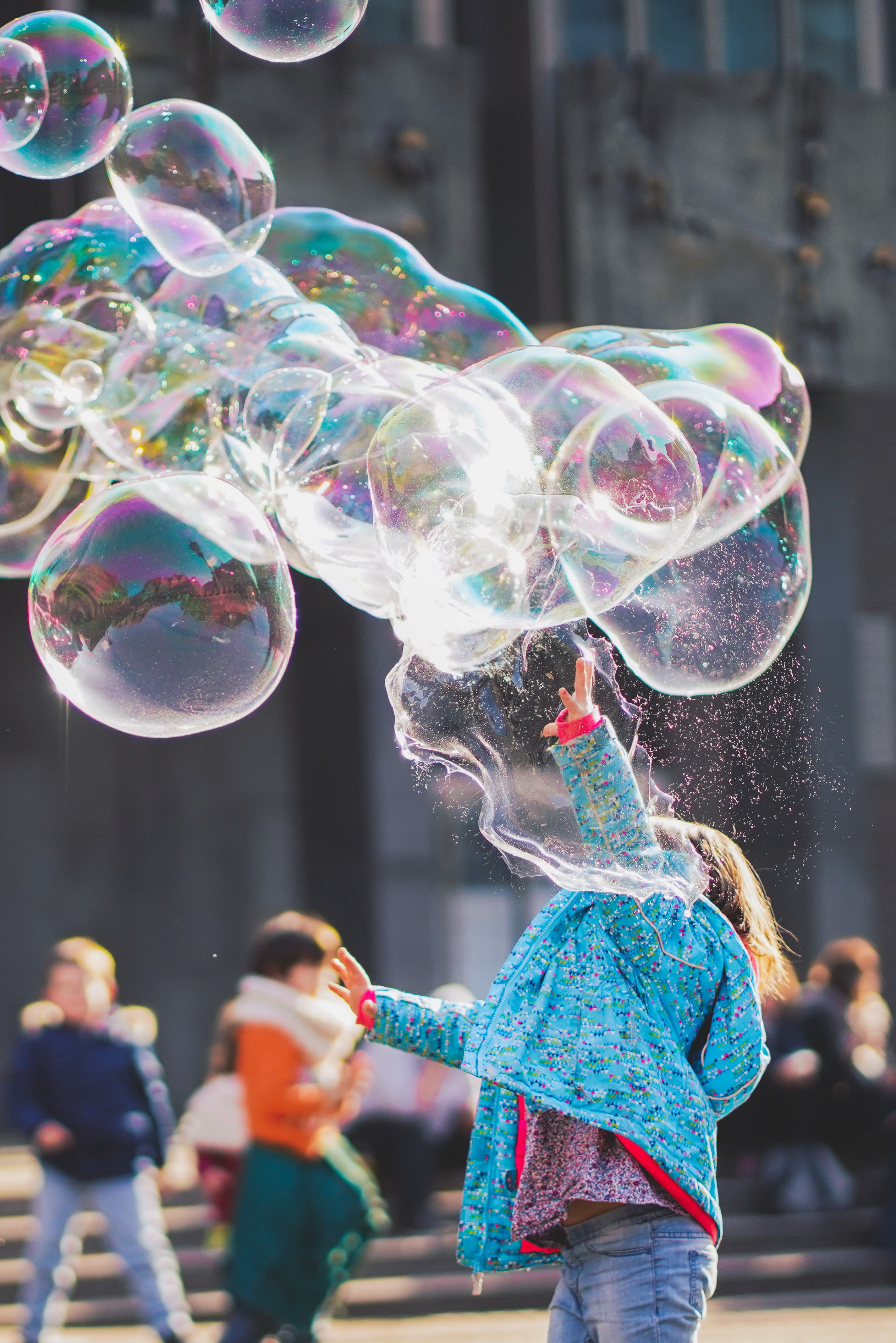 child blowing bubbles